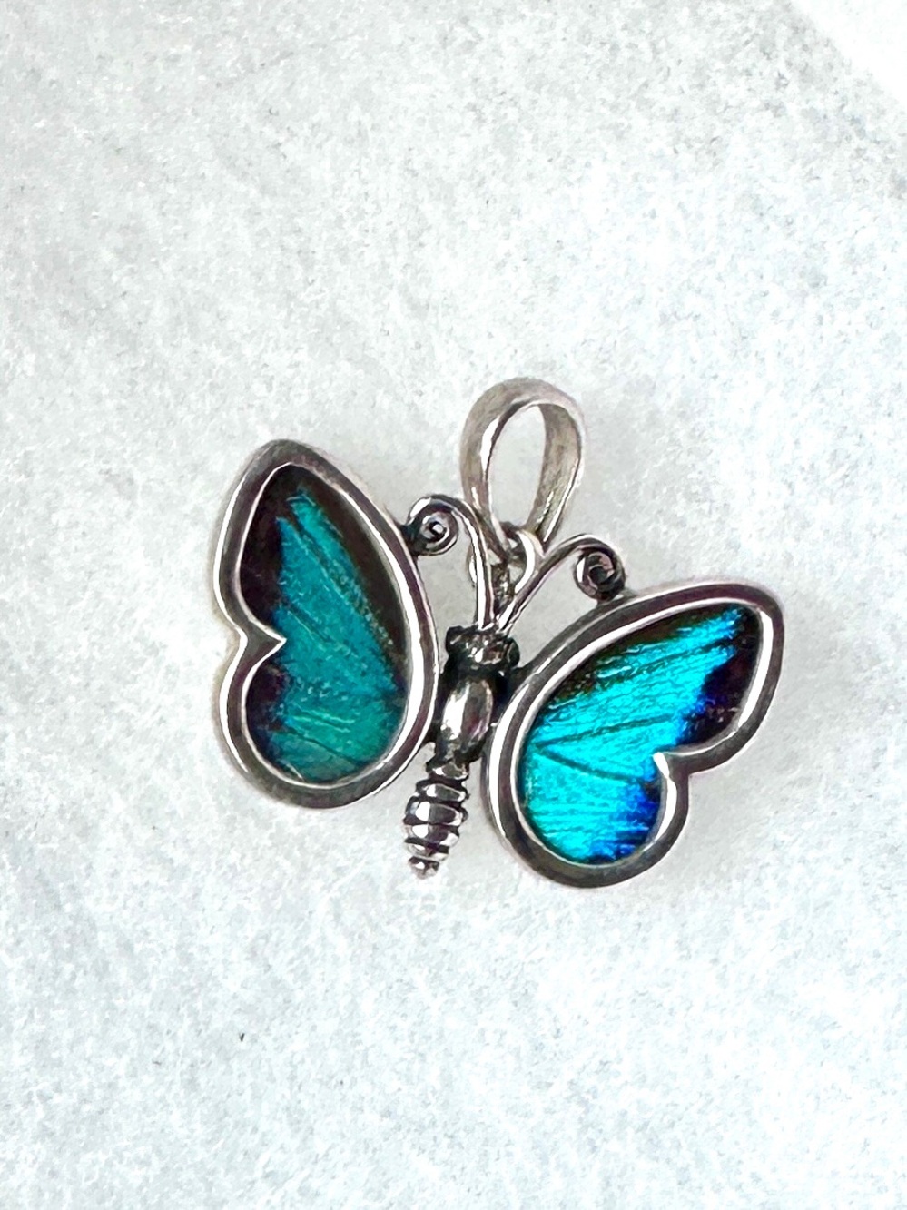 Reversible Silver Butterfly Pendant with Blue-Green and Camouflage Wings